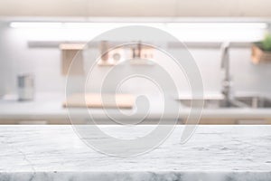 Selective focus,Marble table top on blur white kitchen room background