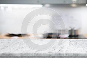 Selective focus,Marble table top on blur white kitchen room background