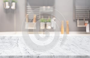 Selective focus,Marble table top on blur white kitchen room background.F