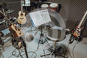 selective focus microphone and blur musical equipment guitar ,lyric, drum piano background.