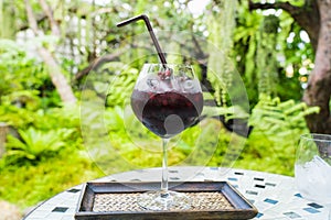 Selective focus Mixed Berries Drink against tree background