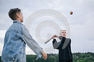 selective focus of mother and son playing baseball