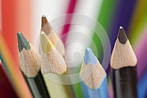 Selective focus on multi coloured pencils. Close-up view on bright colored pencils for drawing. Creativity concept