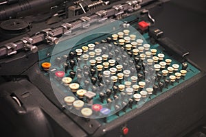 Selective focus, old calculating machine, or mechanical calculator at Science Museum in London