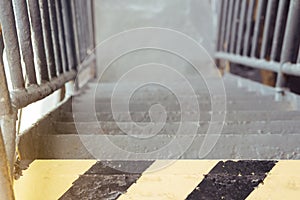 Selective focus of old and rusty iron stairs on ferry boat and b