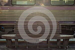 Selective focus on the old wooden vintage chair at the train sta