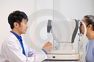 Selective focus at Optometry frame equipment. While doctor using penlight and subjective refraction to  examine eye visual system