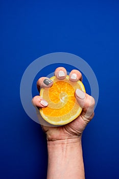 Selective focus, orange in hand