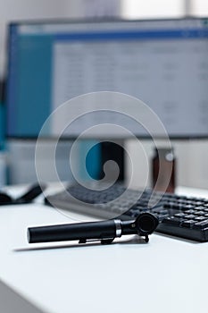 Selective focus on otoscopy medical tool standing on table in hospital professional cabient office