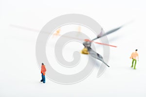Selective focus of people figures and black and red arrows of watch on white background