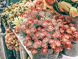 The selective focus photo of artificial orange flowers