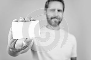 selective focus photo of blank credit card with laptop. blank credit card isolated on yellow.