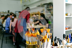 Selective focus photo. blurred image of people engaged in creativity at the masterclass photo