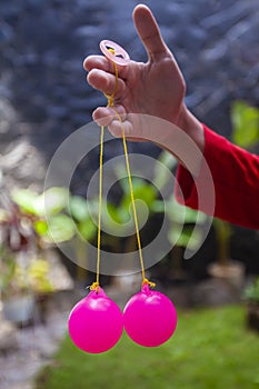 Selective focus photo of Lato-Lato, a traditional children`s toy which is currently going viral, especially in Indonesia.