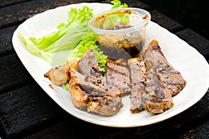 A selective focus picture of famous Malaysian adopt Thai recipe call daging harimau menangis in beef version. photo
