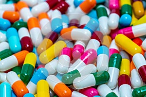 Selective focus on pile of antibiotic capsule pills. Antibiotic drug resistance concept. Colorful capsule pills. Pharmaceutical