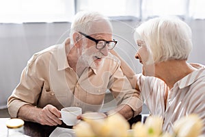 Selective focus of positive senior woman