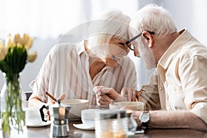 Selective focus of positive senor couple