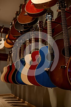 Selective focus on rack of guitar string instrument at music shop