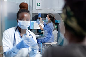 Selective focus on radiologist asisstant analyzing lungs radiography