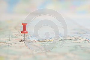 Selective focus of  Red pin on map background