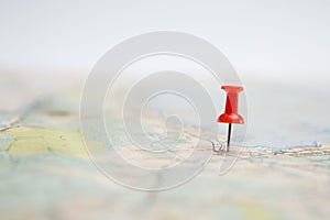 Selective focus of  Red pin on map background