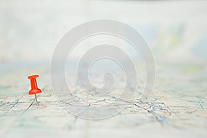 Selective focus of Red pin  on map background