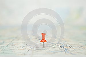 Selective focus of Red pin  on map background