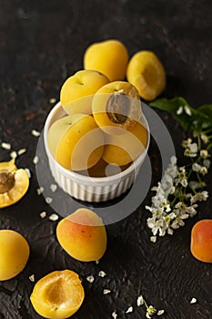 selective focus: ripe fresh apricots in a clay bowl