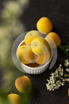 selective focus: ripe fresh apricots in a clay bowl