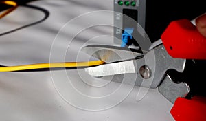 Selective focus scissors cut fiber optic network cables. cut the internet network cable.