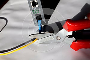 Selective focus scissors cut fiber optic network cables. cut the internet network cable.