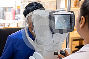 Selective focus at screen of Optometry equipment. While optometrist using subjective refraction to  examine eye visual system of photo