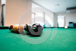 Selective focus shot of billiard balls on a pool table