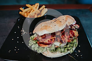 Selective focus shot of a burger with french fries