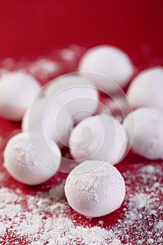 Selective focus shot of Chinese sweet dumplings on a red background