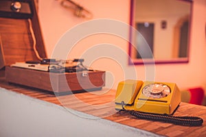 Selective focus shot of an old rotary dial telephone on a table