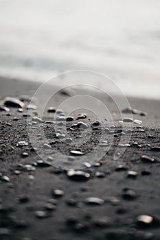 Selective focus shot of small pebbles on the seashore