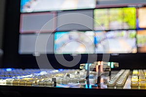 Selective focus shot of TV broadcast switcher and multiview
