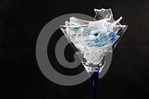 Selective focus shot of a wine glass filled with shattered glass