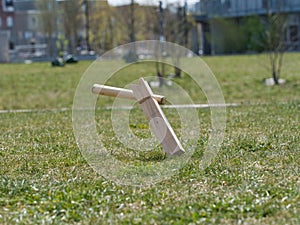 Selective focus shot of wooden pieces of traditional Viking chess on the grass-covered fiel