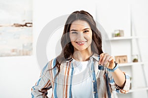 Selective focus of smiling woman holding