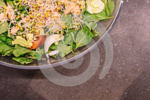 Selective focus of a Soy sprouts salad and Slate background