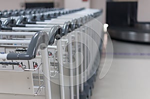 Selective focus of stack of trolley line at the airport with gre