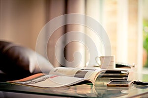 selective focus of stacking magazine place on table in living room