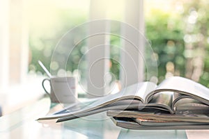 selective focus of stacking magazine place on table in living room