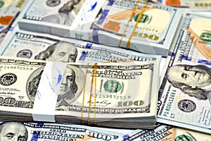 Selective focus of stacks of American money banknote background, Obverse side of 100 $ One hundred American dollars bill