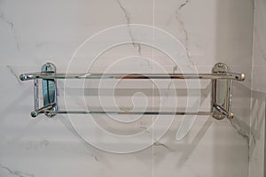 selective focus stainless rail for drying towel in bathroom after taking a bath