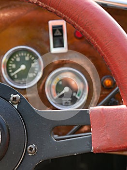 Selective focus of steering wheel and dashboard of classic car
