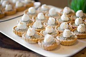 Selective focus of Tart on white dish on the buffet table